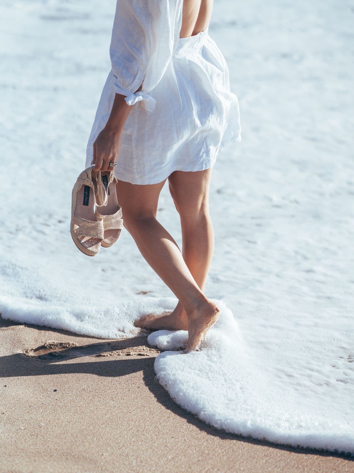 Bare feet at the water's edge
