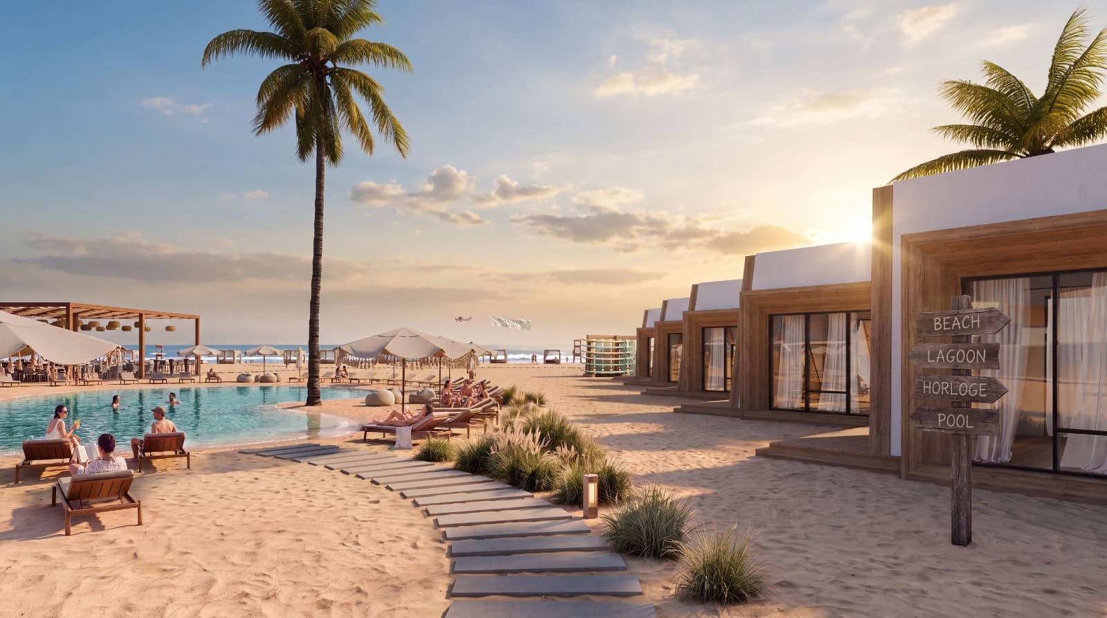 The hotel's rooms on the sand in the late sun, and a signpost to the beach, the lagoon, Horloge and the pool