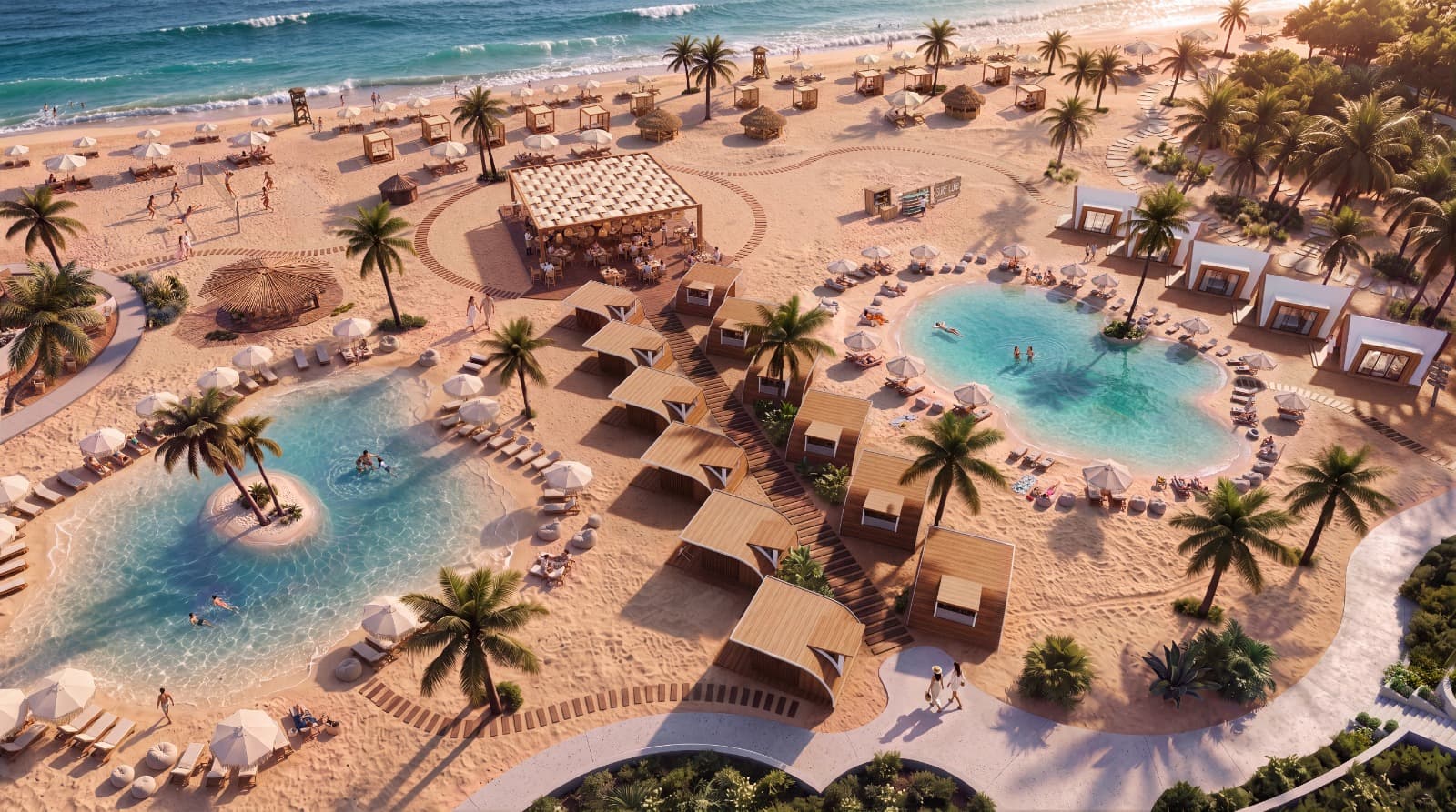 NAVAIA's beach club from above: the sea, a dining pavilion, cabanas and a lagoon pool